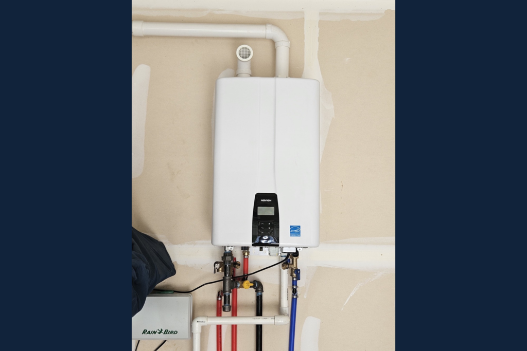 Installed tankless water heater with venting and plumbing connections